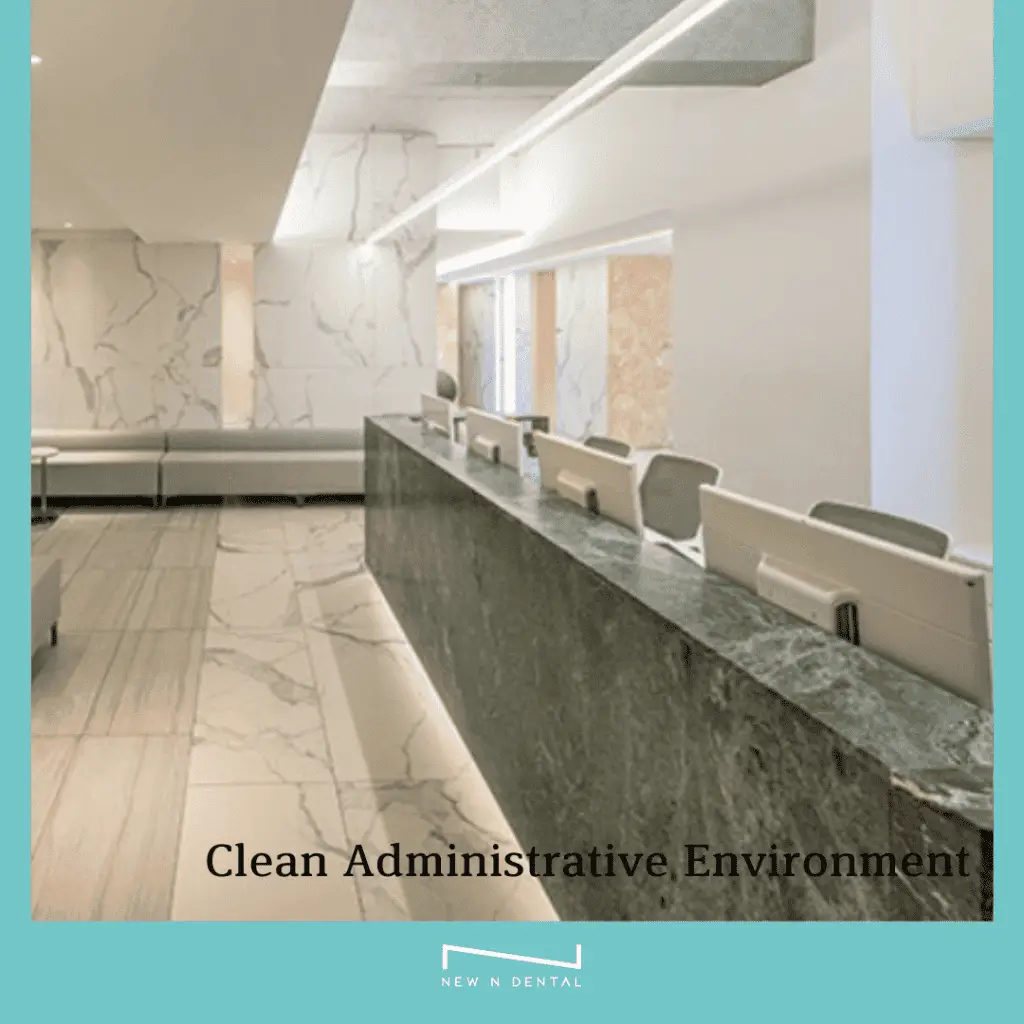 Modern dental office reception area with marble countertops and clean design.