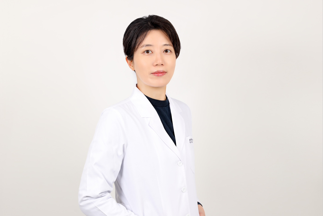 Dr. JeongHyun LEE, Orthodontics Specialist in white coat, providing expert dental care. • KOREA NEW N DENTAL CLINIC